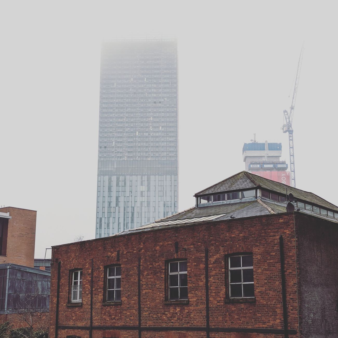 Brick building and city rooftops
